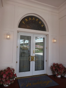 Entrance featuring wedding ring door handles.